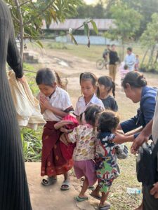 Kids at school giving school supplies